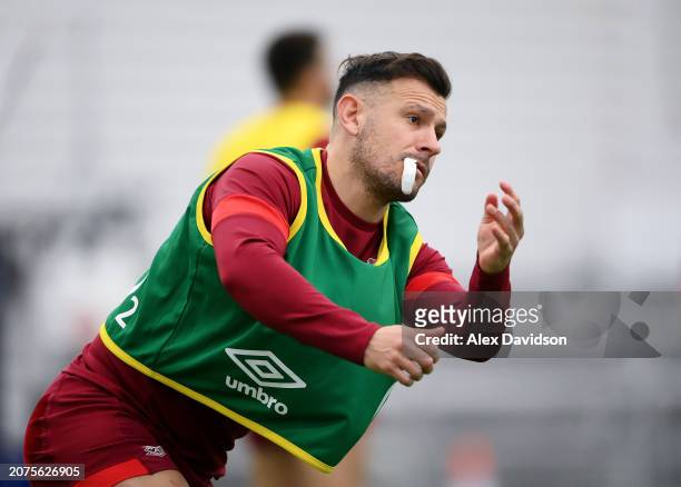 Danny Care of England looks on after passing the ball during the England Training Session at Pennyhill Park on March 11, 2024 in Bagshot, England.