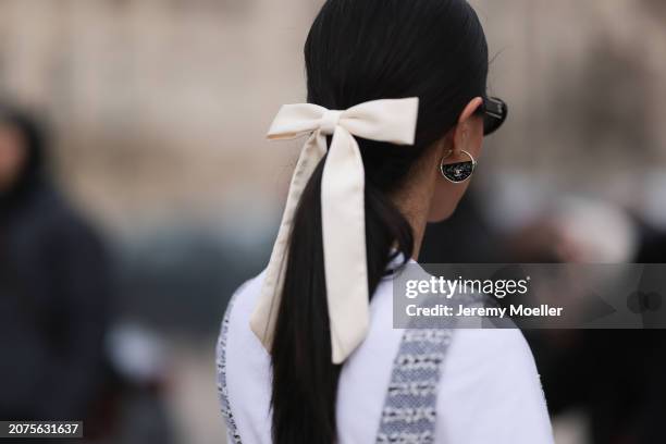 Mehrnaz Ansari seen wearing a white t-shirt, grey tweed playsuit, silver Chanel star bag, white socks, black Chanel sandals and a white loop outside...