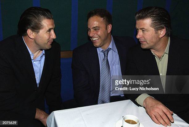 Actor Alec Baldwin chats to his brother Billy Baldwin and his agent as they attend the post-premiere party of "The Cooler" on June 11, 2003 at the...