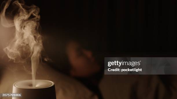 humidifier at bedroom. - aromatherapy diffuser stock pictures, royalty-free photos & images