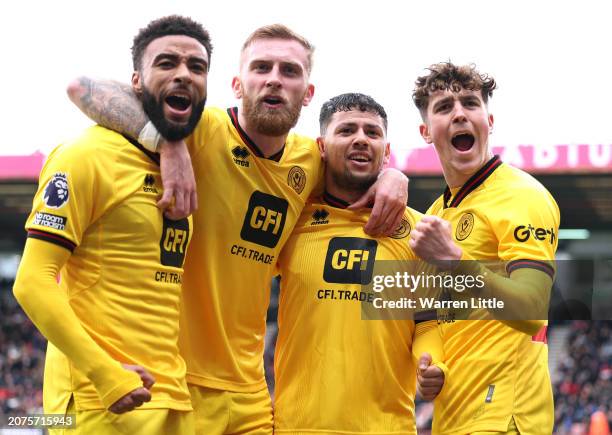 Gustavo Hamer of Sheffield United celebrates scoring his team's first goal with teammates Jayden Bogle, Oliver McBurnie and Oliver Luke Arblaster of...