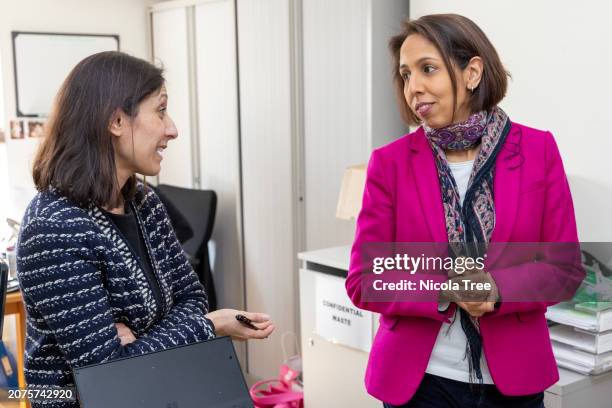 Munira Wilson Liberal Democrat MP for Twickenham visits a local GP practice in her constituency discussing the current strains and workload of the...