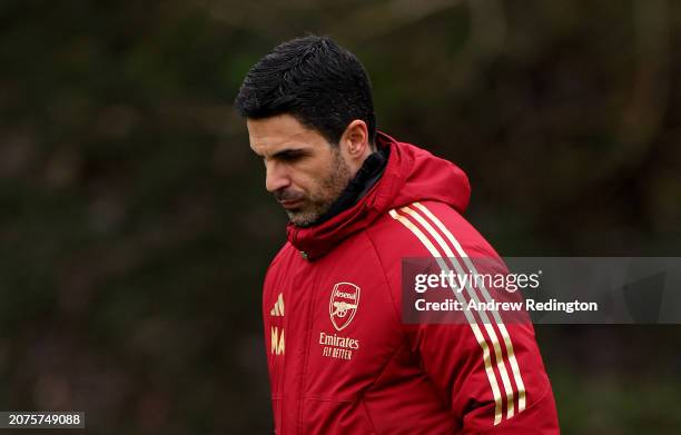 Mikel Arteta, Manager of Arsenal, walks onto the pitch prior to the Arsenal FC Training Session And Press Conference at Sobha Realty Training Centre...