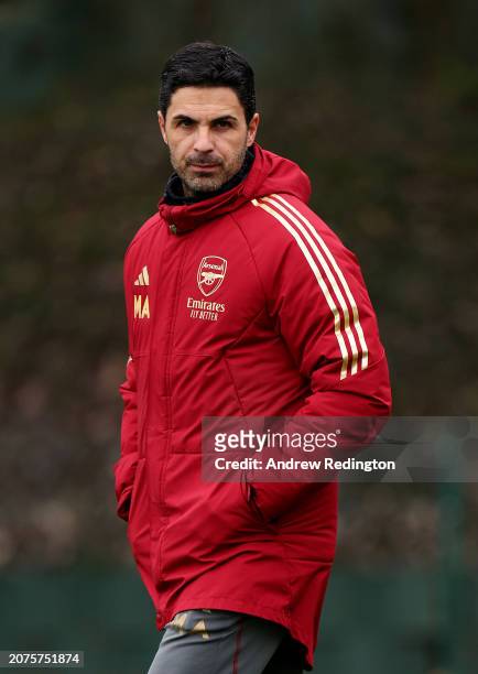 Mikel Arteta, Manager of Arsenal, looks on as he walks onto the pitch prior to the Arsenal FC Training Session And Press Conference at Sobha Realty...