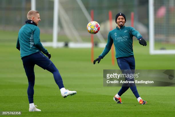 Gabriel Jesus of Arsenal passes the ball to Oleksandr Zinchenko during the Arsenal FC Training Session And Press Conference at Sobha Realty Training...