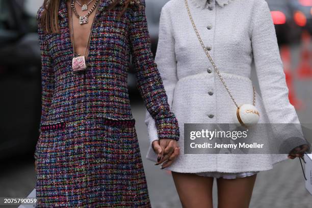 Camila Coelho & Aimee Song seen wearing a long checkered and purple Chanel suit, white and black ballarinas, Chanel white handbag, sunglasses and a...