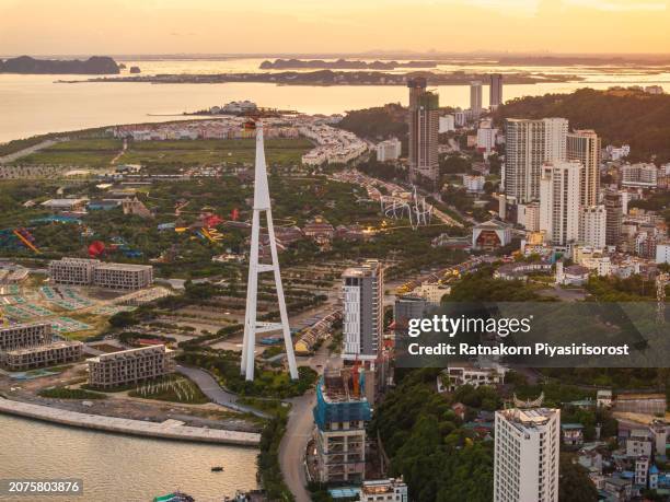 aerial drone sunset scene cityscape of ha long city, vietnam - hanoi cityscape stock pictures, royalty-free photos & images