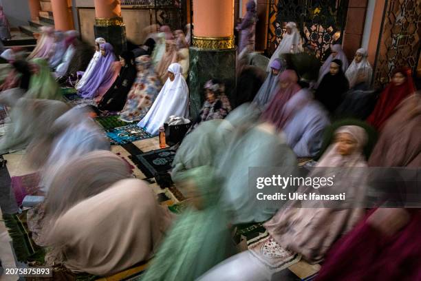 Indonesian muslims perform Tarawih prayers to mark the start of the holy month of Ramadan at UGM Campus Mosque on March 11, 2024 in Yogyakarta,...