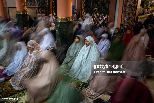 Indonesian muslims perform Tarawih prayers to mark the start of the holy month of Ramadan at UGM Campus Mosque on March 11, 2024 in Yogyakarta,...