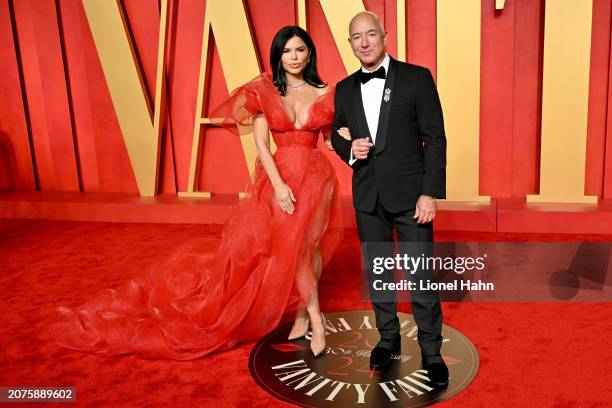 Lauren Sanchez, Jeff Bezos attend the 2024 Vanity Fair Oscar Party Hosted By Radhika Jones at Wallis Annenberg Center for the Performing Arts on...