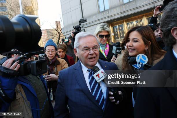 Senator Bob Menendez is surrounded by media while departing a Manhattan court following an arraignment on new charges in the federal bribery case...