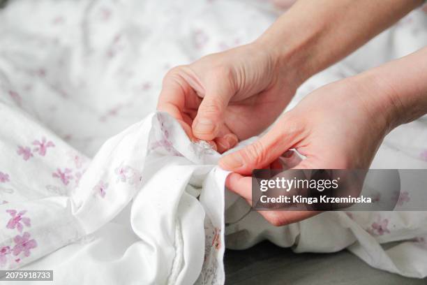 changing bedsheets - sleep hygiene stock pictures, royalty-free photos & images