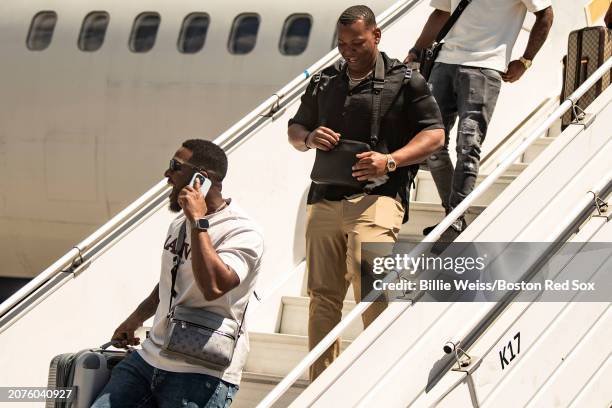 Joely Rodriguez and Rafael Devers of the Boston Red Sox arrive before the 2024 Dominican Republic Series against the Tampa Bay Rays at Estadio...