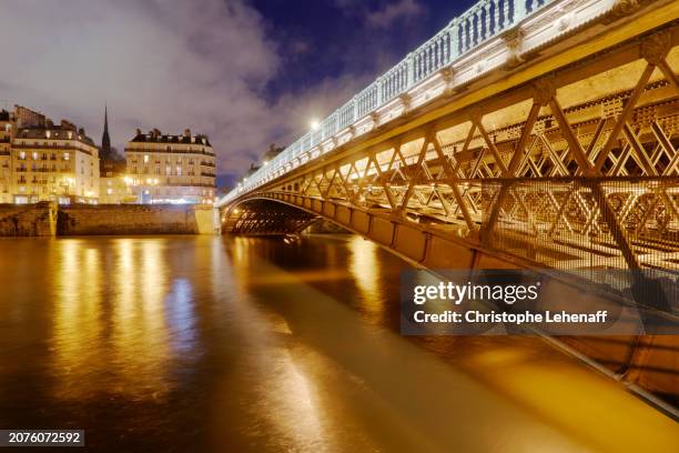 paris at night, close up on arcole bridge, france - bridge architecture up close night stock pictures, royalty-free photos & images