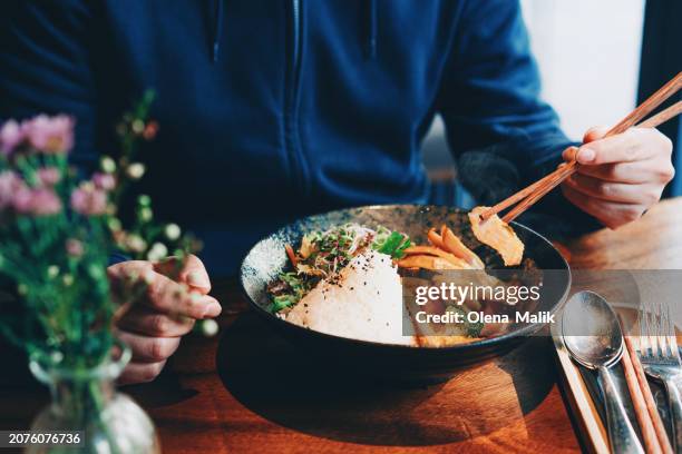 man eating authentic malaysian food. asian style cuisine and food culture. - soya bean sprout stock pictures, royalty-free photos & images