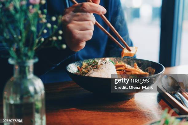 man eating authentic malaysian food. asian style cuisine and food culture. - soya bean sprout stock pictures, royalty-free photos & images