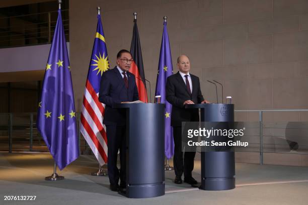 German Chancellor Olaf Scholz and Malaysian Prime Minister Anwar Ibrahim speak to the media during talks at the Chancellery on March 11, 2024 in...