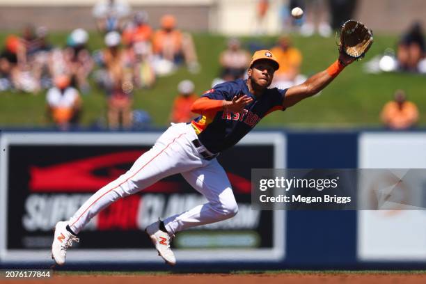 Jeremy Pena of the Houston Astros attempts to catch the ball for an out against the Detroit Tigers during the third inning in a spring training game...