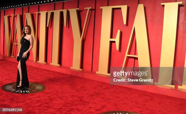Isla Fisher arrives at the 2024 Vanity Fair Oscar Party Hosted By Radhika Jones at Wallis Annenberg Center for the Performing Arts on March 10, 2024...
