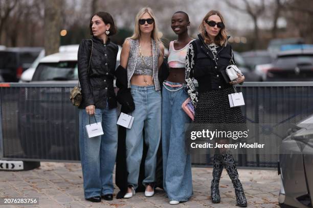 Chiara Baratello wears black skirt, vest, white bag & Linda Tol wears denim jeans, grey cropped top, vest & Erika Boldrin wears black jacket, denim...