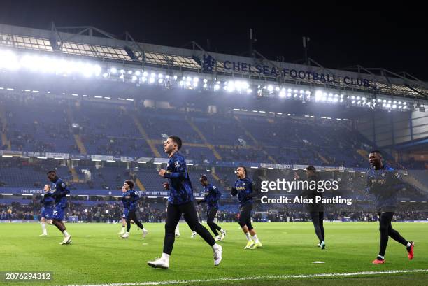 Chelsea players warm up prior to the Premier League match between Chelsea FC and Newcastle United at Stamford Bridge on March 11, 2024 in London,...