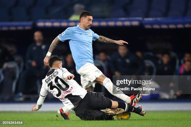 Mattia Zaccagni of SS Lazio is tackled by Lautaro Gianetti of Udinese Calcio during the Serie A TIM match between SS Lazio and Udinese Calcio - Serie...