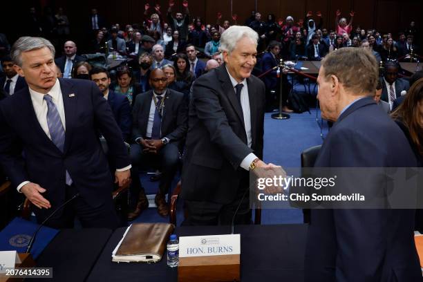 Federal Bureau of Investigation Christopher Wray and Central Intelligence Agency Director William Burns greet Senate Select Committee on Intelligence...