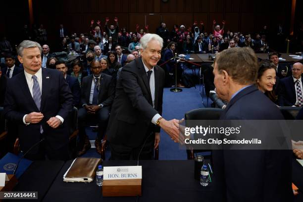 Federal Bureau of Investigation Christopher Wray and Central Intelligence Agency Director William Burns greet Senate Select Committee on Intelligence...