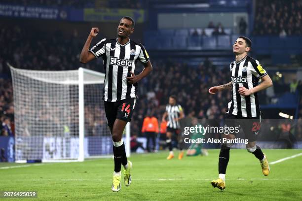 Alexander Isak of Newcastle United celebrates scoring his team's first goal with teammate Miguel Almiron during the Premier League match between...