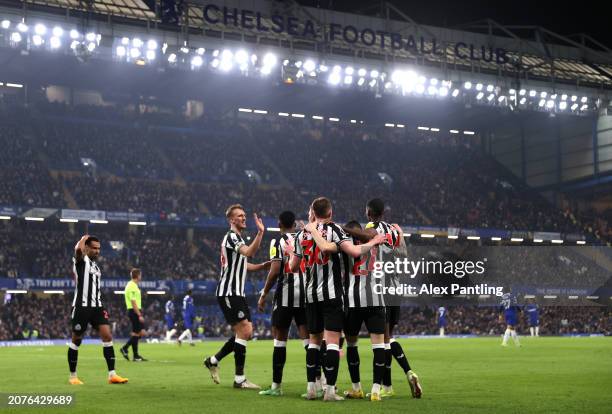 Alexander Isak of Newcastle United celebrates scoring his team's first goal with teammates during the Premier League match between Chelsea FC and...