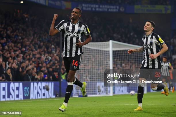 Alexander Isak of Newcastle United celebrates with Miguel Almiron after scoring their first goal during the Premier League match between Chelsea FC...