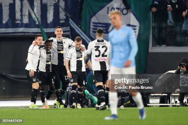Lorenzo Lucca of Udinese Calcio celebrates scoring his team's first goal with teammates during the Serie A TIM match between SS Lazio and Udinese...