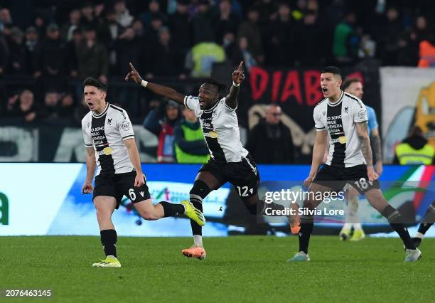 Oier Zarraga of Udinese Calcio celebrates with teammates Hassane Kamara and Nehuén Pérez after scoring the second goal during the Serie A TIM match...