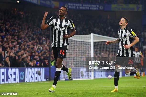 Alexander Isak of Newcastle United celebrates with Miguel Almiron after scoring their first goal during the Premier League match between Chelsea FC...