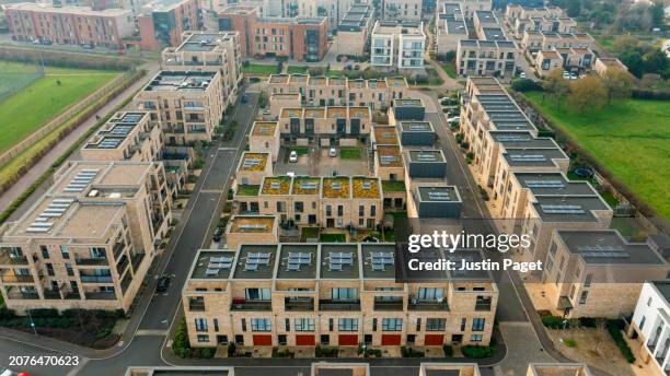 drone view of a newly built residential district in cambridge, uk - green roof stock pictures, royalty-free photos & images