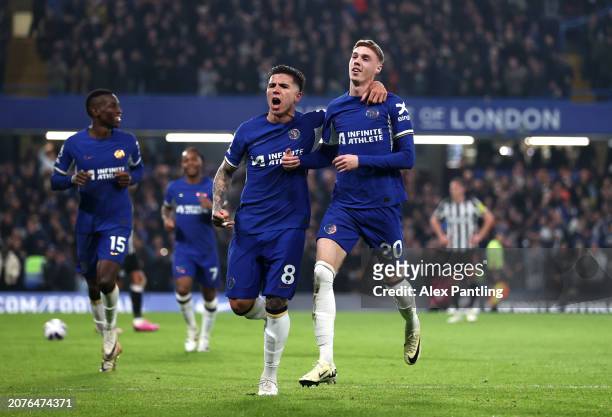 Cole Palmer of Chelsea celebrates scoring his team's second goal with teammate Enzo Fernandez during the Premier League match between Chelsea FC and...