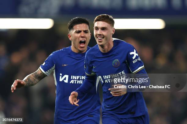 Cole Palmer of Chelsea celebrates scoring his team's second goal with teammate Enzo Fernandez during the Premier League match between Chelsea FC and...