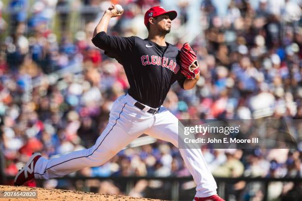 Carlos Carrasco of the Cleveland Guardians pitches during the fifth inning of the Spring Training Game against the Los Angeles Dodgers at Goodyear...