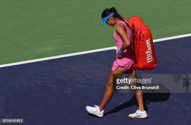 Emma Raducanu of Great Britain shows her dejection as she walks off court after her straight sets defeat against Aryna Sabalenka in their third round...