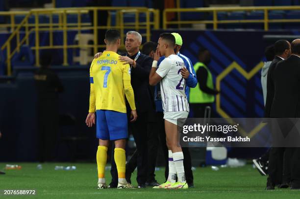 Cristiano Ronaldo of Al Nassr interacts with Hernan Crespo, Head Coach of Al Ain, following a loss in the penalty shootout in the AFC Champions...