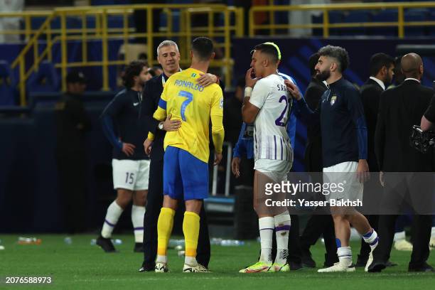 Cristiano Ronaldo of Al Nassr interacts with Hernan Crespo, Head Coach of Al Ain, following a loss in the penalty shootout in the AFC Champions...