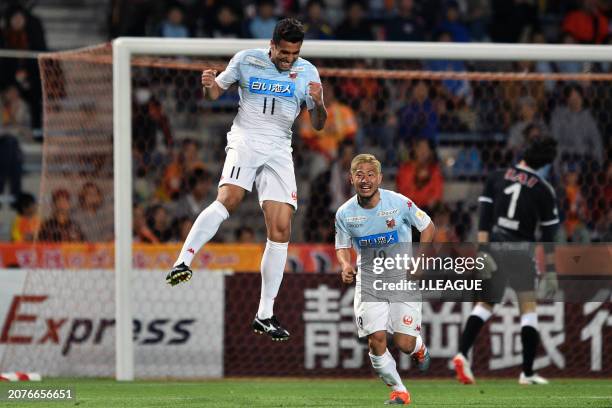 Jonathan Reis of Consadole Sapporo celebrates with teammate Kosuke Shirai after scoring the team's first goal during the J.League YBC Levain Cup...