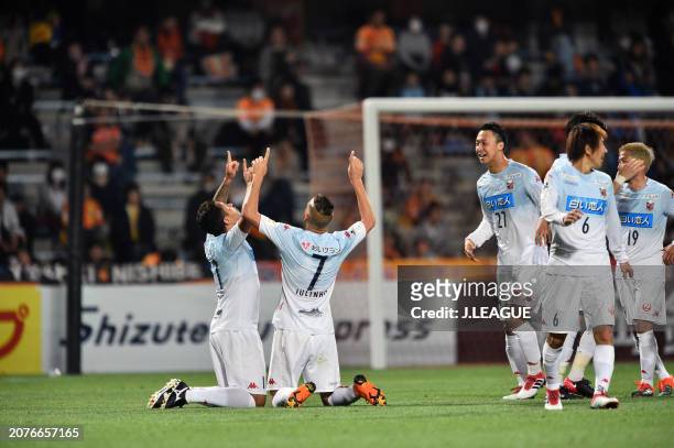 Jonathan Reis of Consadole Sapporo celebrates with teammates after scoring the team's first goal during the J.League YBC Levain Cup Group B match...