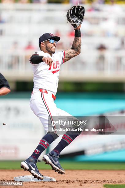 Carlos Correa of the Minnesota Twins fields during a spring training game against the Boston Red Sox on March 1, 2024 at the Lee County Sports...