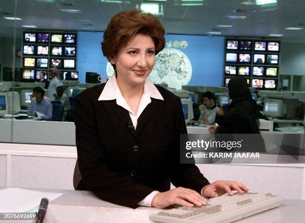 Muntaha al-Rumahi, television announcer and presenter for the Qatari-based Al-Jazeera television channel, seen in the Doha studios 13 October 2001....