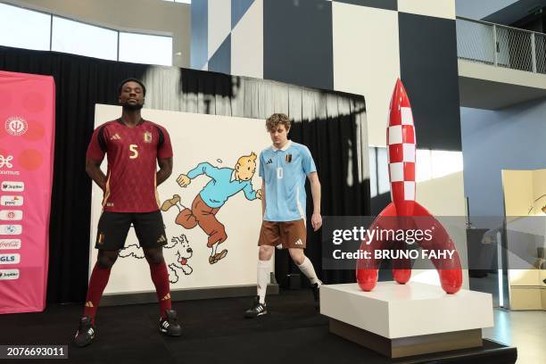 Two models show the home and away outfits, during a press conference of Belgian national soccer team Red Devils to present the new shirts for the...