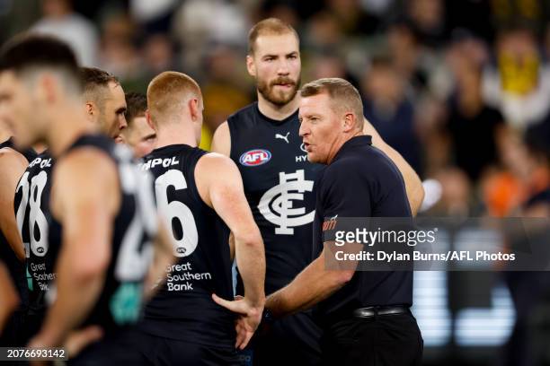 Michael Voss, Senior Coach of the Blues addresses his players during the 2024 AFL Round 01 match between the Carlton Blues and the Richmond Tigers at...
