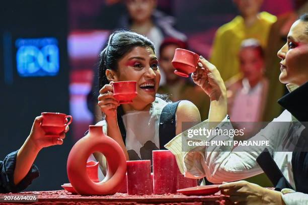 Bollywood actresses Konkona Sen Sharma and Neha Dhupia present creations by designer Sohaya Misra during the second day of Lakmé Fashion Week x FDCI,...