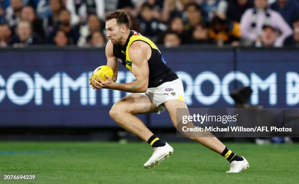 Noah Balta of the Tigers in action during the 2024 AFL Round 01 match between the Carlton Blues and the Richmond Tigers at the Melbourne Cricket...