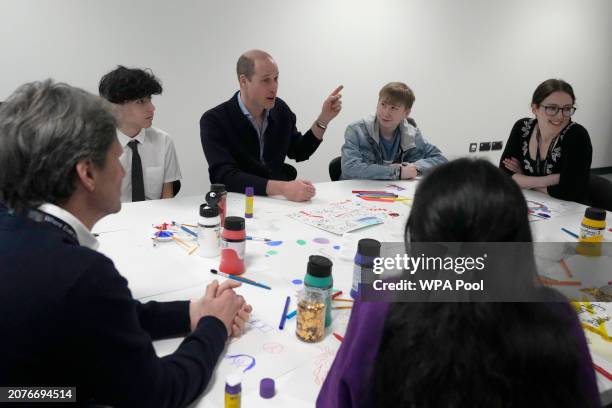 Prince William, Prince Of Wales gestures as he interacts with young people during his visit to WEST, a new OnSide Youth Zone WEST on March 14, 2024...
